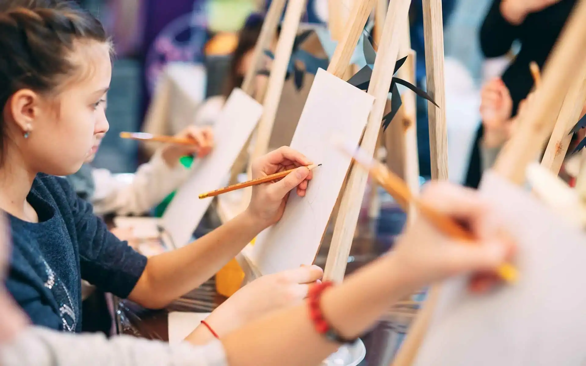 Girl Painting On Easel